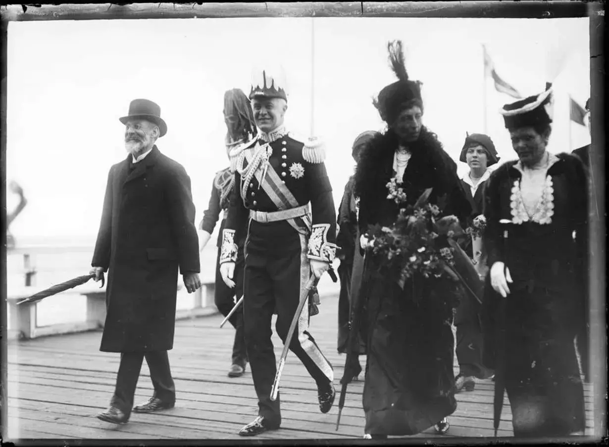 Joseph Cook walking on a pier  