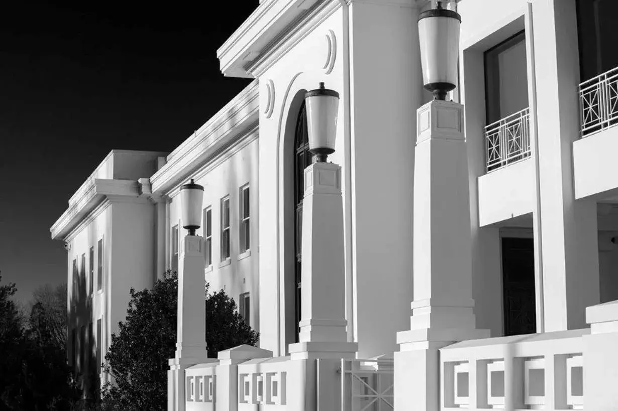 A black and white image of the architecture of Old Parliament House. 