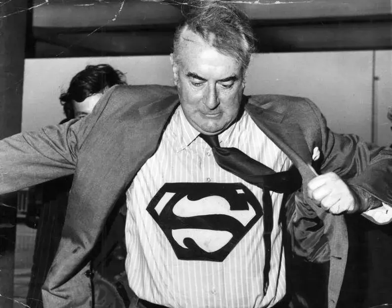 Gough Whitlam wearing a superman symbol on his shirt. 