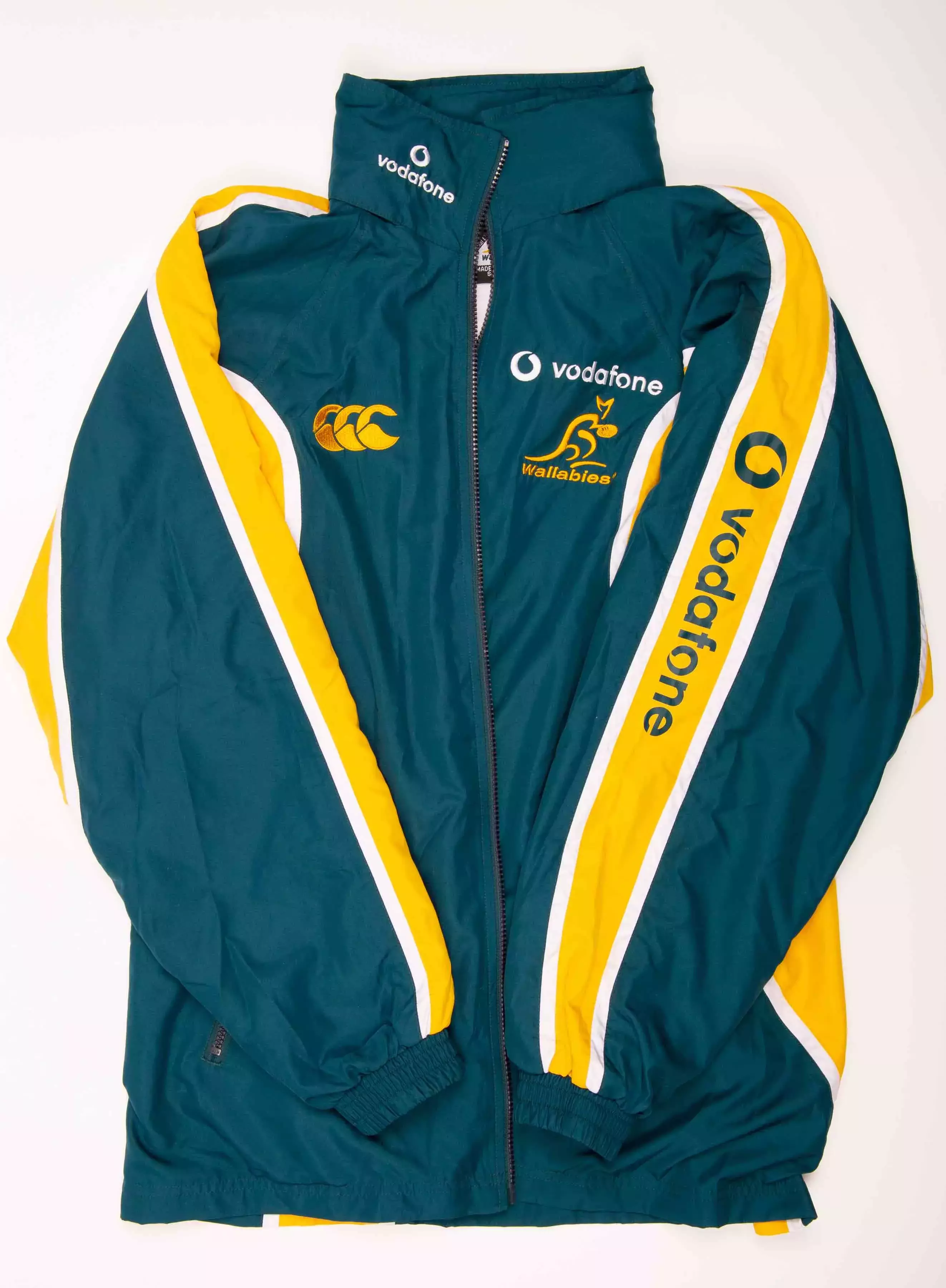 A green and gold Australian tracksuit top. 