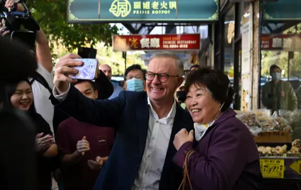 Anthony Albanese takes a selfie with a constituent.